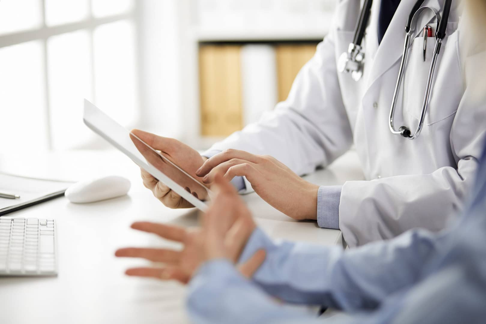 Unknown,Male,Doctor,And,Patient,Woman,Discussing,Current,Health,Examination