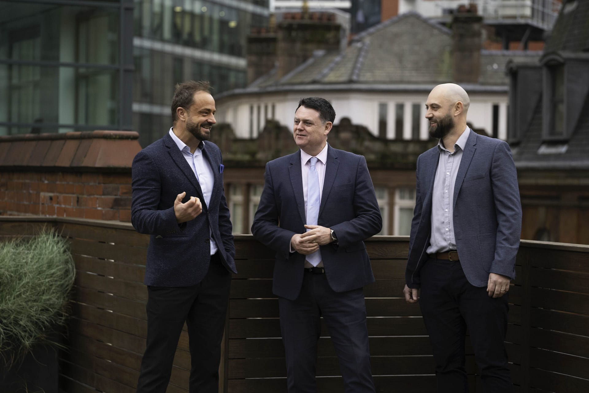 Three Men in suits having a discussion