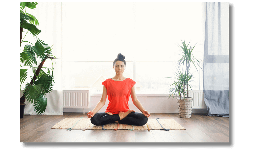 Woman sat with legs crossed meditating