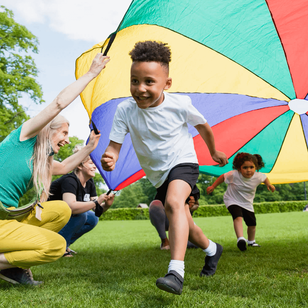 Children playing parachute games in PE.