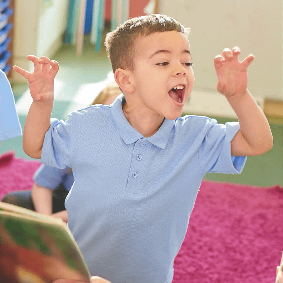Primary school boy storytelling in a roaring pose