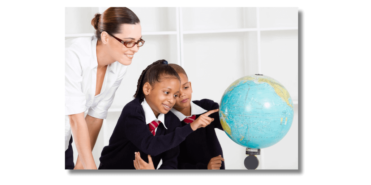 Teacher and pupils looking at a world globe