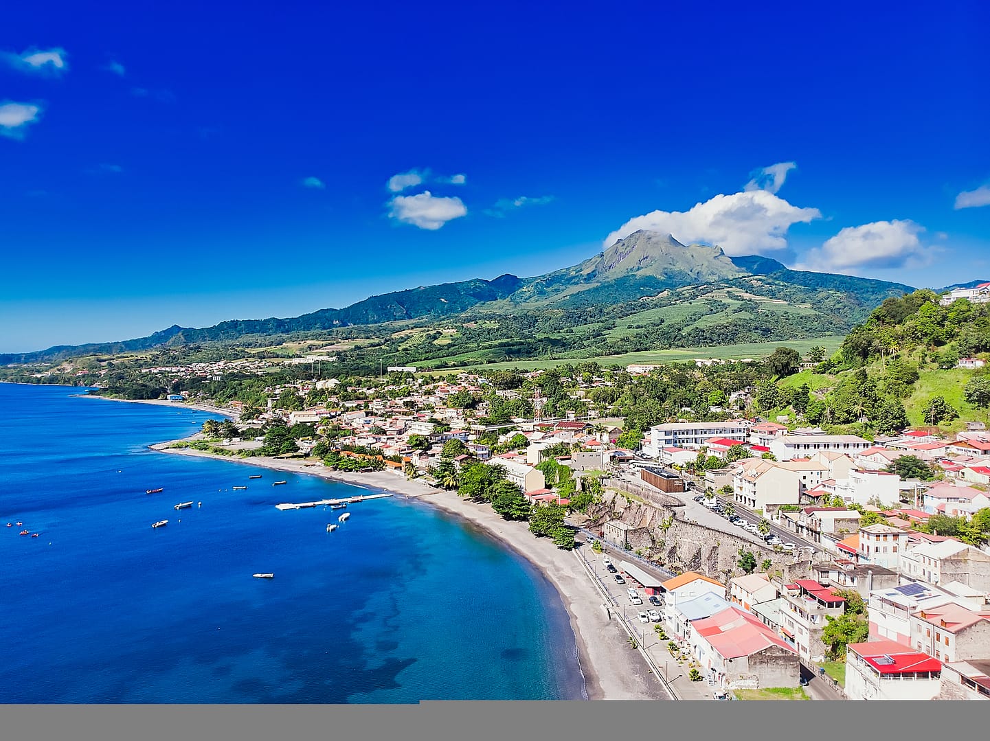 Why do people live near volcanoes?