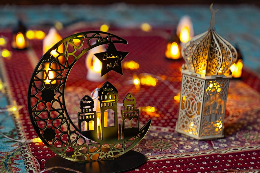 Ramadan decoration featuring a crescent moon and a traditional lantern