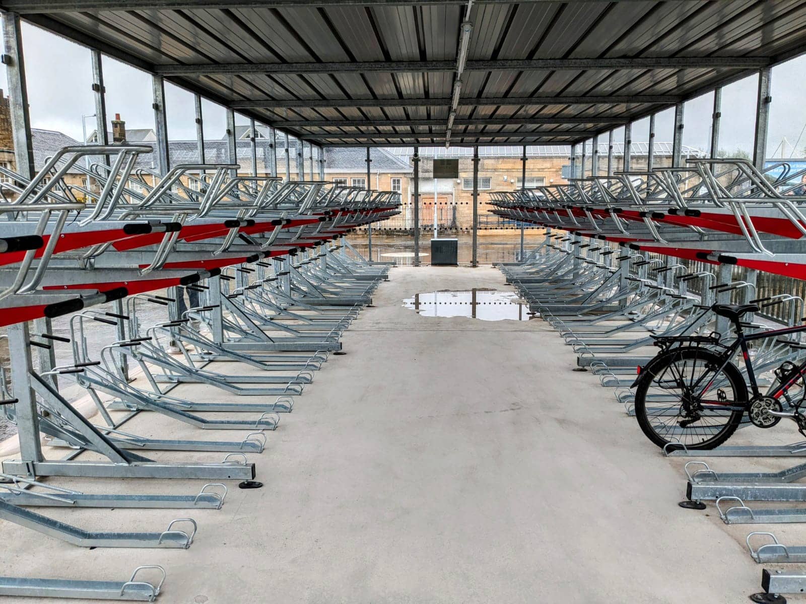 Secure cycle hub with two-tier cycle parking racks