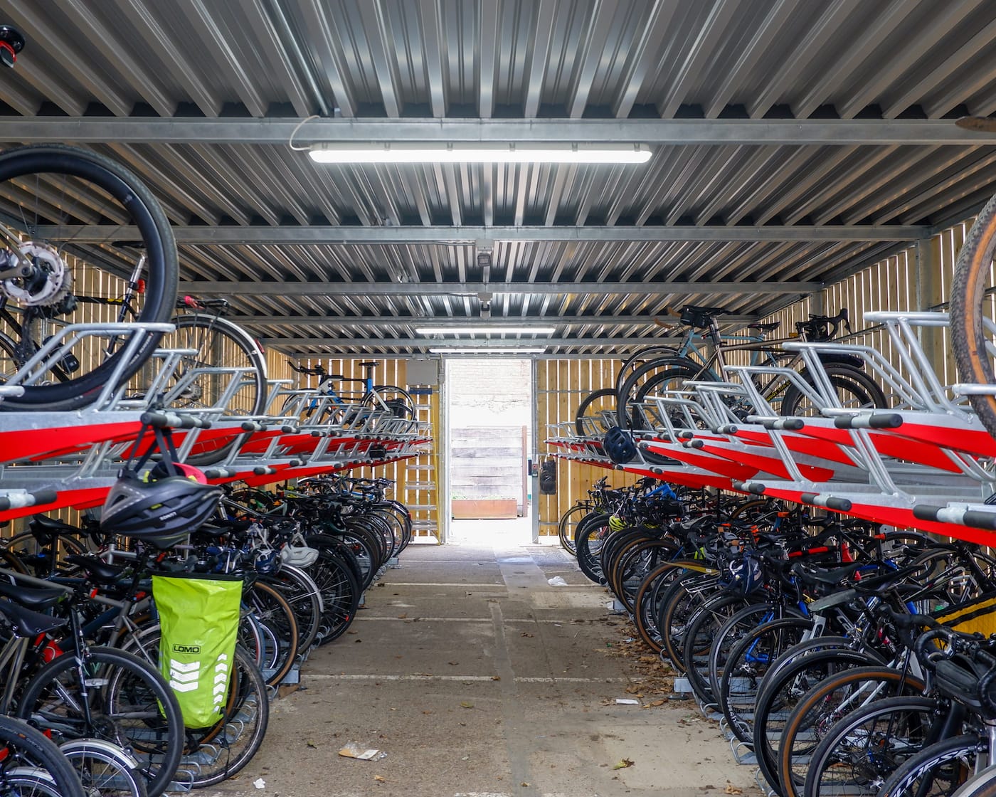 two-tier bike racks inside wooden cycle shelter