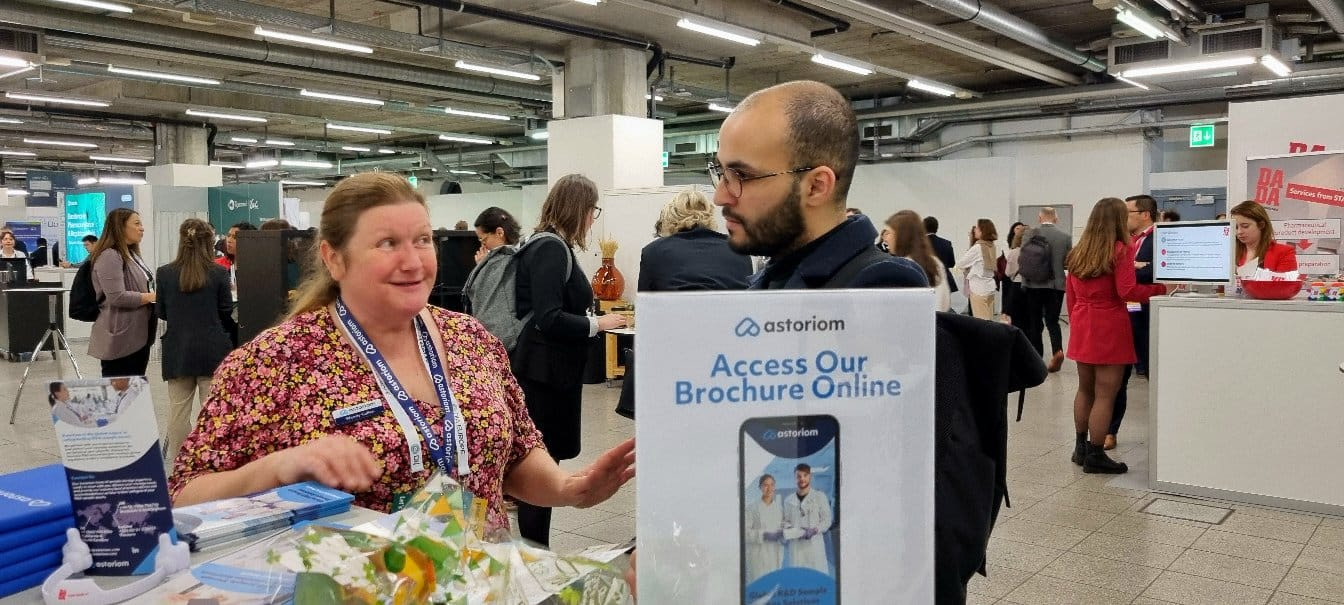 Astoriom's BDM talking to a scientist