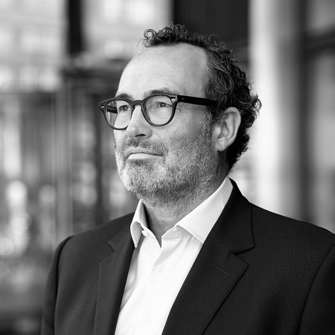 Black and white formal headshot of Jonathan Freeman.