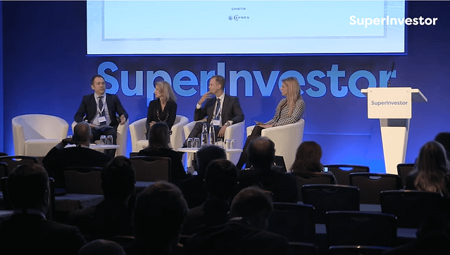 Four professionals form a panel on stage at SuperInvestor conference.