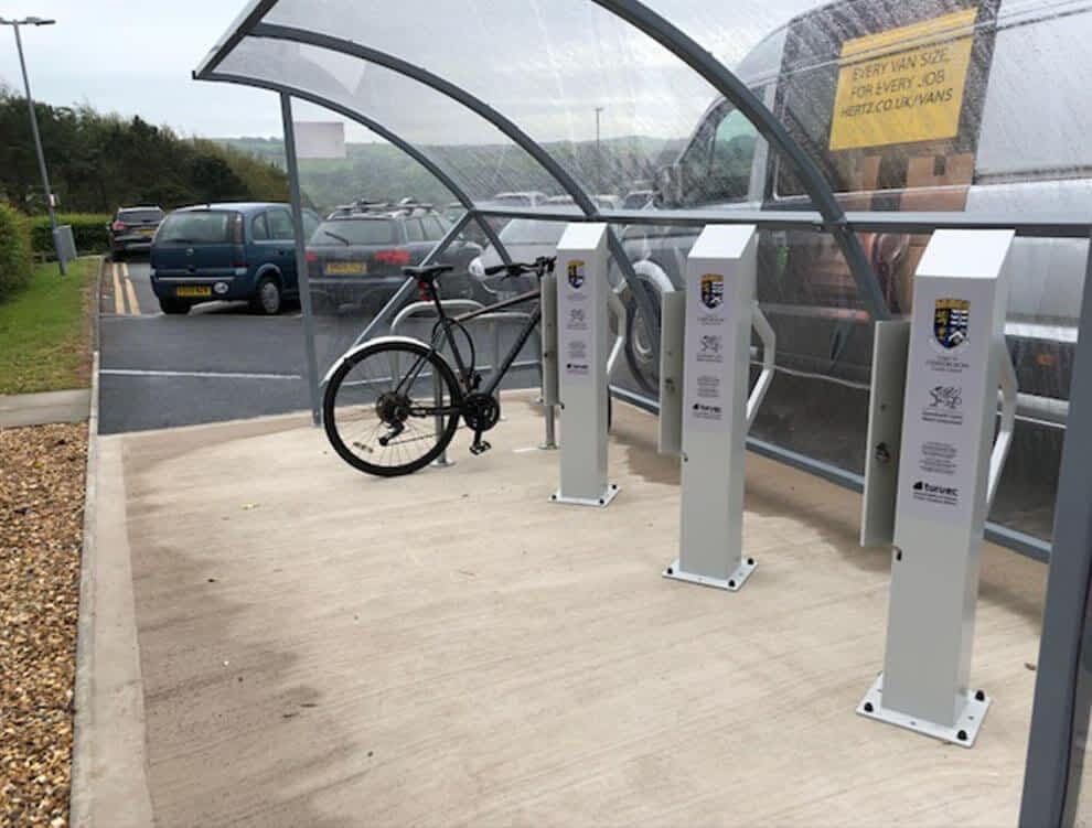 Glass curved bike shelter with electric stations