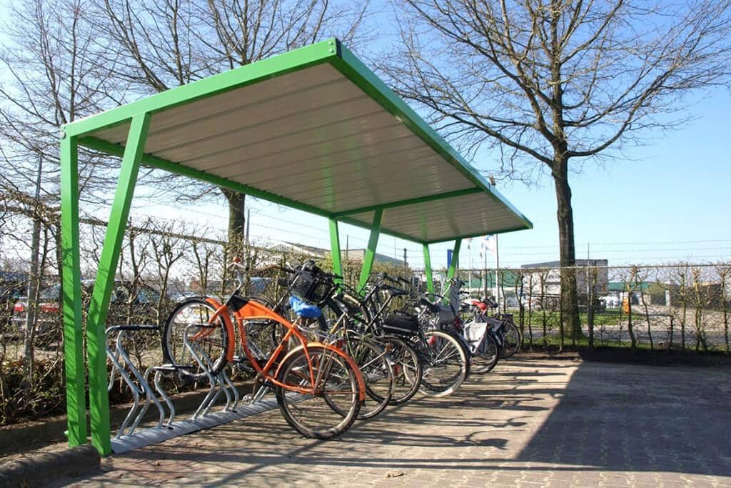 Green open bike shelter with bike racks